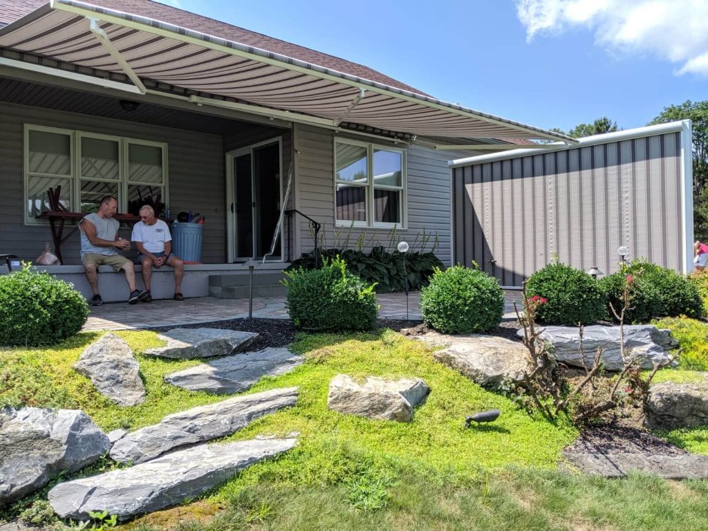 People Sitting Under Awning